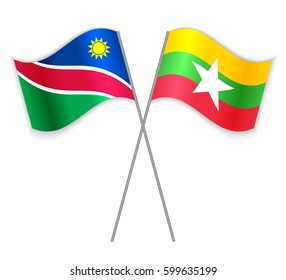 Namibian and Burmese crossed flags. Namibia combined with Myanmar isolated on white. Language learning, international business or travel concept.