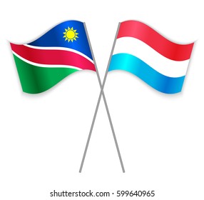 Namibian and Luxembourgish crossed flags. Namibia combined with Luxembourg isolated on white. Language learning, international business or travel concept.