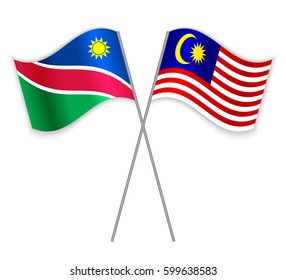 Namibian and Malaysian crossed flags. Namibia combined with Malaysia isolated on white. Language learning, international business or travel concept.