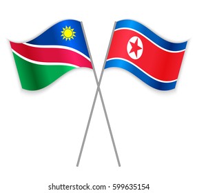 Namibian and North Korean crossed flags. Namibia combined with North Korea isolated on white. Language learning, international business or travel concept.