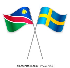 Namibian and Swedish crossed flags. Namibia combined with Sweden isolated on white. Language learning, international business or travel concept.