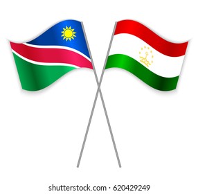 Namibian and Tajikistani crossed flags. Namibia combined with Tajikistan isolated on white. Language learning, international business or travel concept.