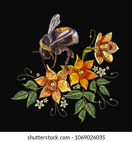 Narcissus and bumble bee embroidery. Beautiful daffodils yellow narcissus and bumble bee embroidery on black background. Template for clothes, textiles, t-shirt design 