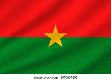 national flag of Burkina Faso on wavy cotton fabric. Realistic vector illustration.