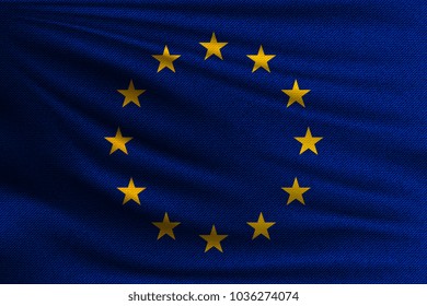 The national flag of European Union. The symbol of the state on wavy cotton fabric. Realistic vector illustration.