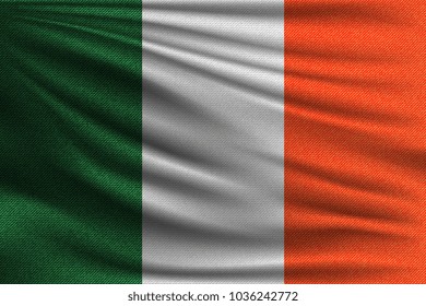 The national flag of Ireland. The symbol of the state on wavy cotton fabric. Realistic vector illustration.