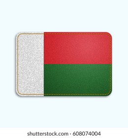 National flag of Madagascar with denim texture and orange seam. Realistic image of a tissue made in vector illustration.