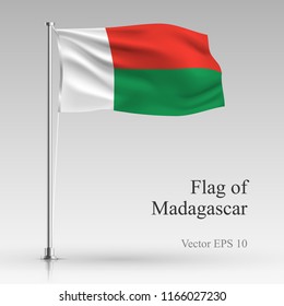 National flag of Madagascar isolated on gray background. Realistic flag waving in the Wind. Wavy flag of Madagascar Vector illustration