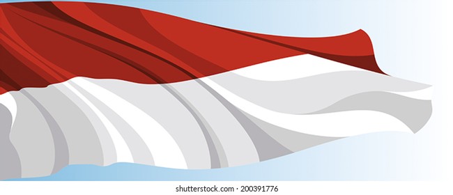The national flag of the Monaco on a background of blue sky