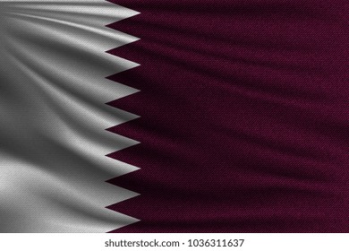 The national flag of Qatar. The symbol of the state on wavy cotton fabric. Realistic vector illustration.