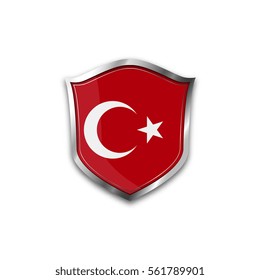 The national flag of Turkey. Metal shield with reflections on a white background.