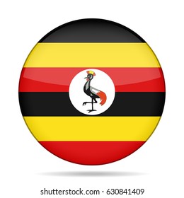 National flag of Uganda. Shiny round button with shadow.