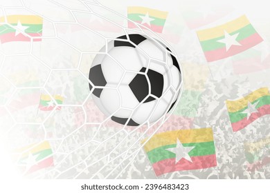 National Football team of Myanmar scored goal. Ball in goal net, while football supporters are waving the Myanmar flag in the background. Vector illustration.