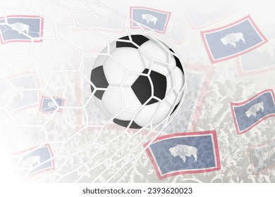 National Football team of Wyoming scored goal. Ball in goal net, while football supporters are waving the Wyoming flag in the background. Vector illustration.