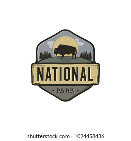 National park vintage badge. Mountain explorer label. Outdoor adventure logo design with bison. Travel and hipster insignia. Wilderness, forest camping emblem. Hiking, backpack. Stock vector.