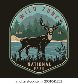 National park vintage colorful logo with deer standing on coast of river on forest and mountain landscape isolated vector illustration