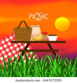 National Picnic Day event banner. Picnic basket with food on a table on a grassy lawn at sunset to celebrate on April 23rd