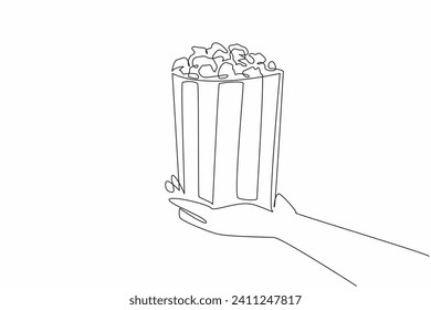 Día Nacional del Palomino. Un dibujo de línea continua de la mano de la persona que sostiene un cubo de papel desechado contiene palomitas de maíz saladas. Un bocadillo de comida para ver el concepto de una película. Ilustración gráfica vectorial de línea única