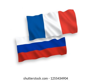 National vector fabric wave flags of France and Russia isolated on white background.
