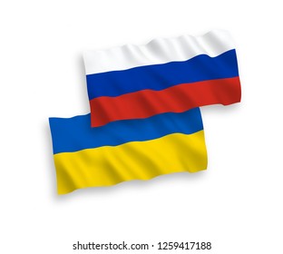 National vector fabric wave flags of Russia and Ukraine isolated on white background.