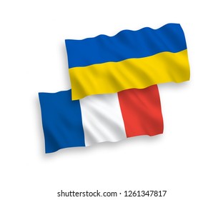 National vector fabric wave flags of France and Ukraine isolated on white background.