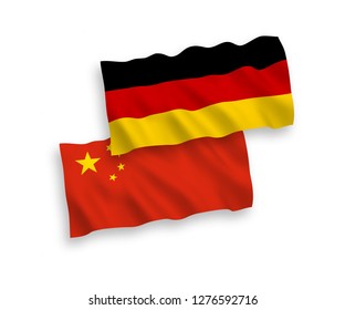 National vector fabric wave flags of Germany and China isolated on white background.