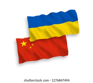 National vector fabric wave flags of Ukraine and China isolated on white background.
