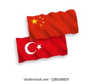 National vector fabric wave flags of Turkey and China isolated on white background.