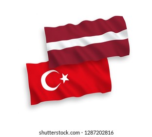 National vector fabric wave flags of Turkey and Latvia isolated on white background.