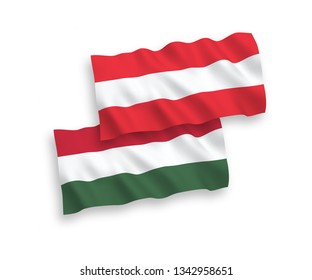 National vector fabric wave flags of Austria and Hungary isolated on white background. 1 to 2 proportion.