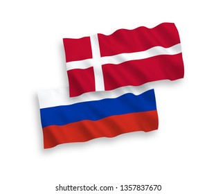 National vector fabric wave flags of Denmark and Russia isolated on white background. 1 to 2 proportion.