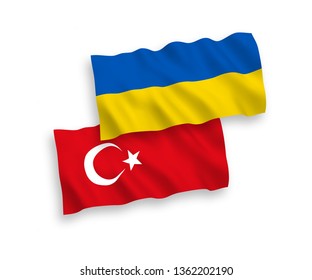 National vector fabric wave flags of Turkey and Ukraine isolated on white background. 1 to 2 proportion.