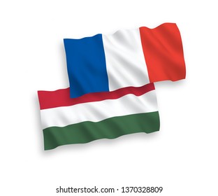 National vector fabric wave flags of France and Hungary isolated on white background. 1 to 2 proportion.