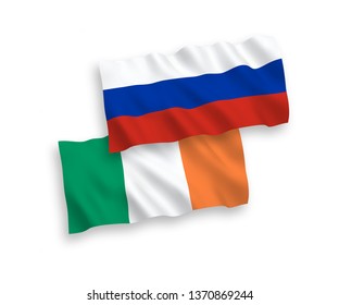 National vector fabric wave flags of Ireland and Russia isolated on white background. 1 to 2 proportion.