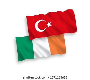 National vector fabric wave flags of Turkey and Ireland isolated on white background. 1 to 2 proportion.