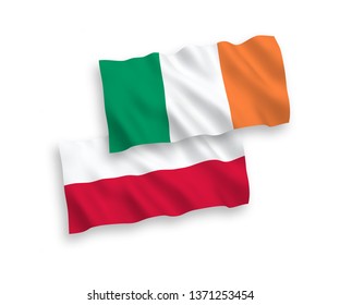 National vector fabric wave flags of Ireland and Poland isolated on white background. 1 to 2 proportion.