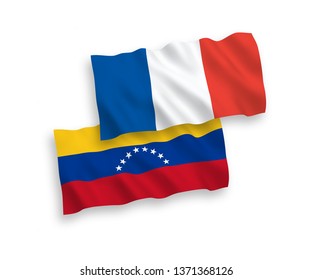National vector fabric wave flags of France and Venezuela isolated on white background. 1 to 2 proportion.