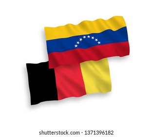 National vector fabric wave flags of Venezuela and Belgium isolated on white background. 1 to 2 proportion.