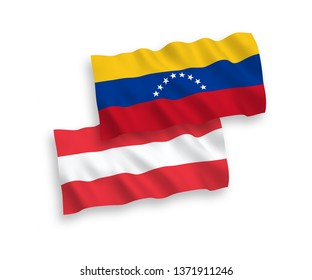National vector fabric wave flags of Austria and Venezuela isolated on white background. 1 to 2 proportion.