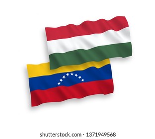 National vector fabric wave flags of Venezuela and Hungary isolated on white background. 1 to 2 proportion.
