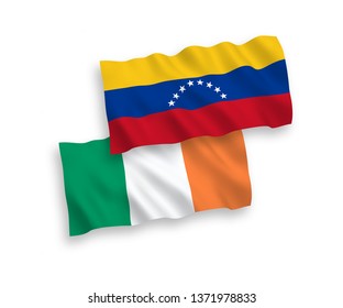 National vector fabric wave flags of Ireland and Venezuela isolated on white background. 1 to 2 proportion.