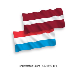National vector fabric wave flags of Latvia and Luxembourg isolated on white background. 1 to 2 proportion.