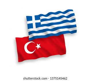 National vector fabric wave flags of Turkey and Greece isolated on white background. 1 to 2 proportion.