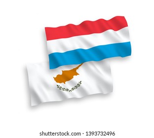 National vector fabric wave flags of Cyprus and Luxembourg isolated on white background. 1 to 2 proportion.