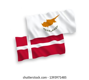 National vector fabric wave flags of Denmark and Cyprus isolated on white background. 1 to 2 proportion.