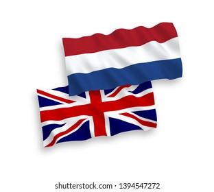National vector fabric wave flags of Great Britain and Netherlands isolated on white background. 1 to 2 proportion.