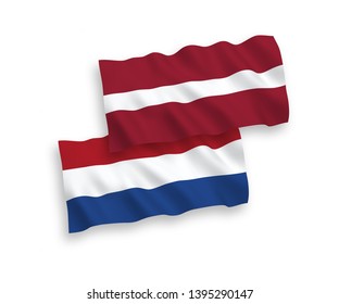 National vector fabric wave flags of Latvia and Netherlands isolated on white background. 1 to 2 proportion.