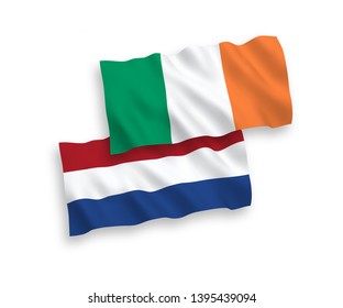 National vector fabric wave flags of Ireland and Netherlands isolated on white background. 1 to 2 proportion.