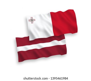 National vector fabric wave flags of Latvia and Malta isolated on white background. 1 to 2 proportion.