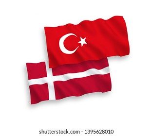 National vector fabric wave flags of Turkey and Denmark isolated on white background. 1 to 2 proportion.